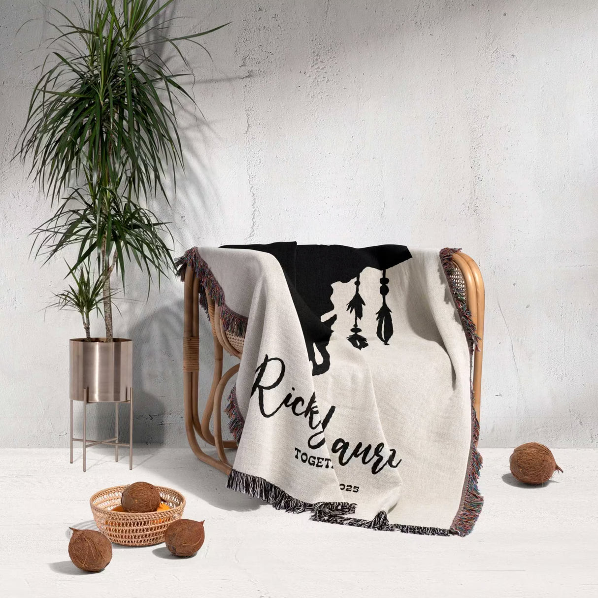 Bull skull boho wedding cotton anniversary gift – woven throw blanket  with 'Ricky & Lauren Together' text draped over a chair in a room with a plant and decorative items.