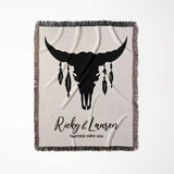 Bull skull boho wedding cotton anniversary gift – woven throw blanket full view with bull skull design and personalized text on a light background