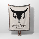 Bull skull boho wedding cotton anniversary gift – woven throw blanket with bull skull design and personalized text held by a person on a white background