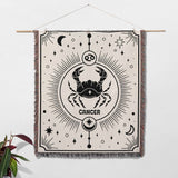 This image shows a Cancer Zodiac Blanket used as wall decor. The woven tapestry features a bold crab design with celestial motifs, ideal for adding an astrological touch to your home as both a decorative piece and a cozy blanket.