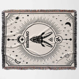 A horizontal view of the Capricorn Zodiac Blanket laid flat, displaying its full design featuring the Capricorn symbol and celestial elements. This woven throw blanket makes a thoughtful and unique birthday gift for both women and men who love astrology.