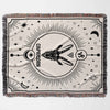 A horizontal view of the Capricorn Zodiac Blanket laid flat, displaying its full design featuring the Capricorn symbol and celestial elements. This woven throw blanket makes a thoughtful and unique birthday gift for both women and men who love astrology.