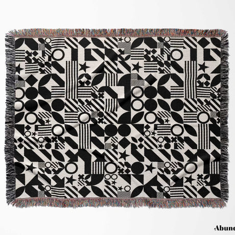 Black and white classical checker board pattern woven blanket throw full view on a white background.