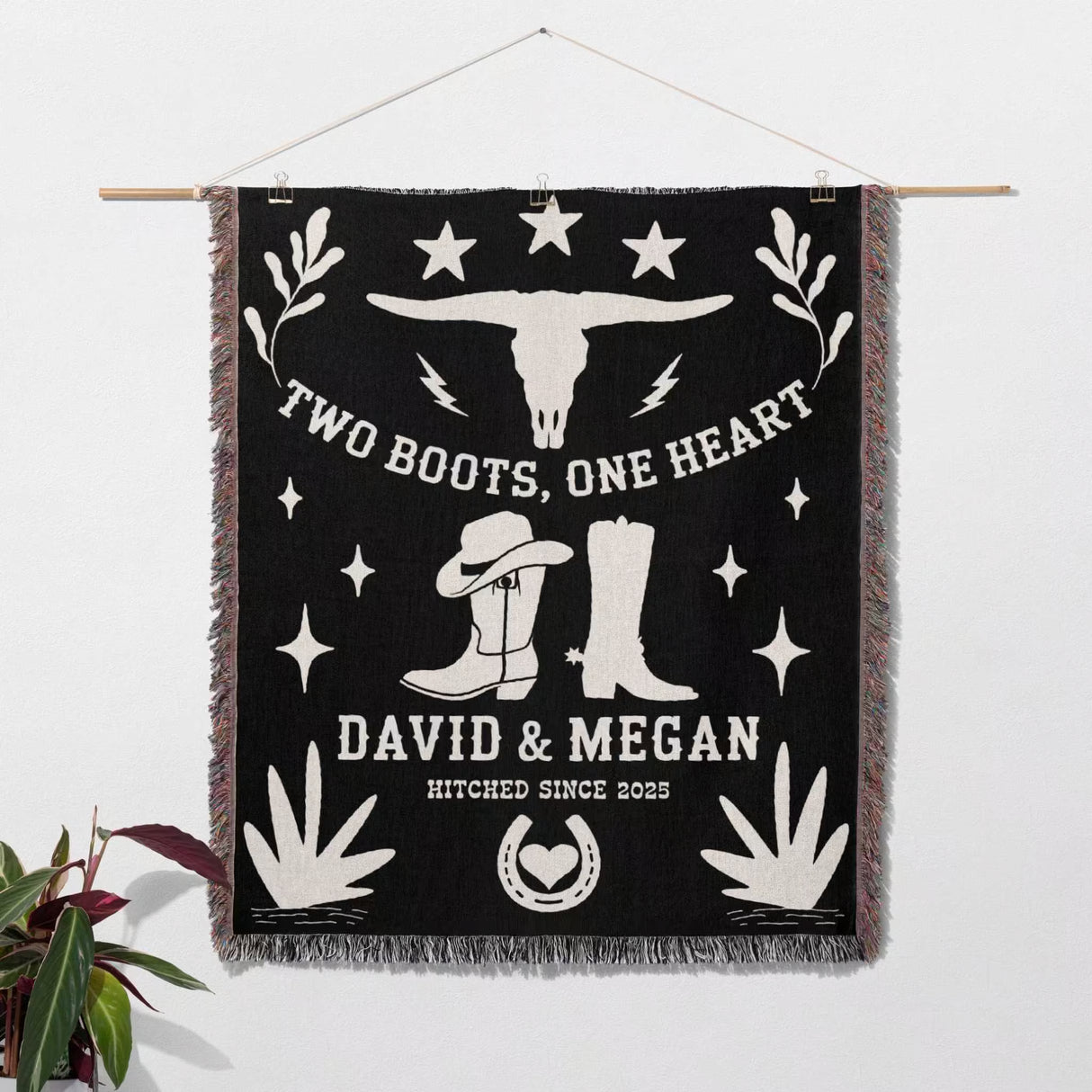 Cow skull and boots 2nd anniversary gift woven throw blanket with cowboy-themed design and personalized text on a white wall as a wall art.