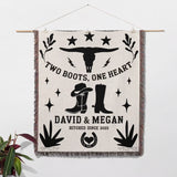 Cow skull and boots cotton anniversary gift woven throw blanket blanket with cowboy-themed design and personalized text, hanging on a wall.