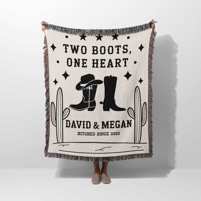 Cowboy boots wedding cotton anniversary gift woven throw blanket held by a person with cowboy boots and text on a white background