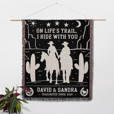 Cowboy and cowgirl 2nd anniversary gift woven throw blanket with cowboy design and personalized text on a white background as a wall tapestry