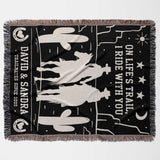 Cowboy and cowgirl 2nd anniversary gift woven throw blanket flat lay with horse and cactus design, featuring text 'On Life's Trail, I Ride With You' and personalized names.