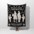 Cowboy and cowgirl 2nd anniversary gift woven throw blanket held by a person with cowboy design and text on a white background