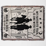 Cowboy and cowgirl couple cotton anniversary gift woven throw blanket flat lay with cowboy design, text, and fringes on a white background