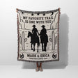 Cowboy and cowgirl couple cotton anniversary gift woven throw blanket with cowboy design and text, held by a person on a white background