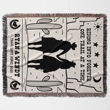 Cowboy and cowgirl western cotton anniversary gift woven throw blanket flat lay with horse design and text on a white background