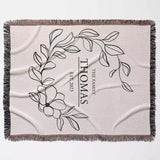 Custom family name cotton throw blanket with floral design and text full view on a light background