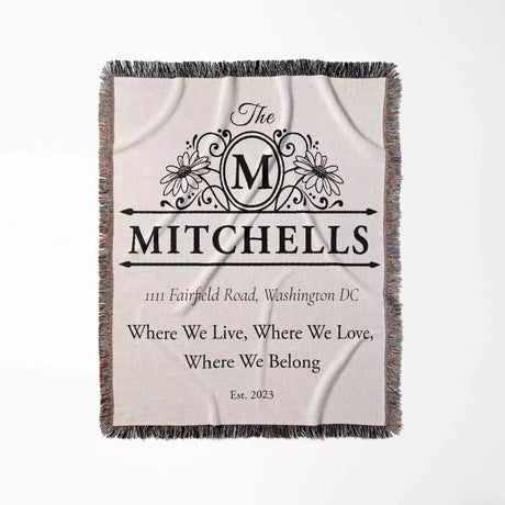 Custom family name and address blanket with family name and address flat lay on a light background