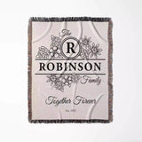 Custom last name cotton blanket with 'Robinson Family Together Forever' design flat lay on a white background