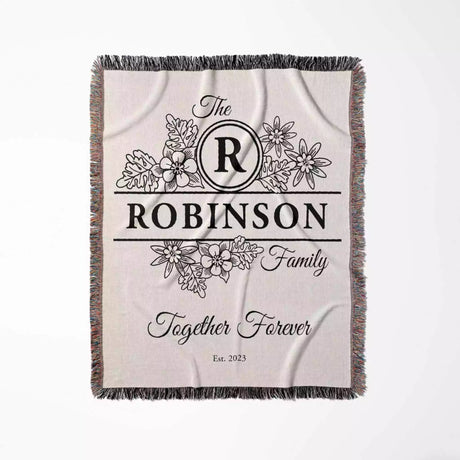 Custom last name cotton blanket with 'Robinson Family Together Forever' design flat lay on a white background