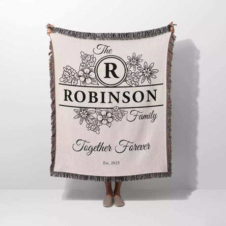 Custom last name cotton blanket with 'The Robinson Family Together Forever' text and floral design on a white background