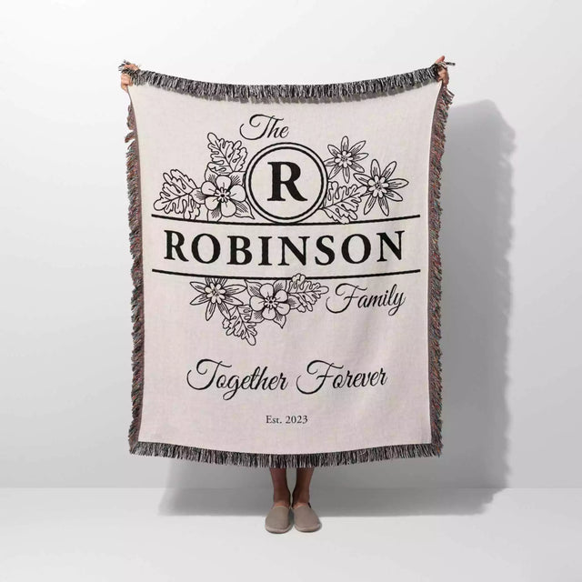 Custom last name cotton blanket with 'The Robinson Family Together Forever' text and floral design on a white background