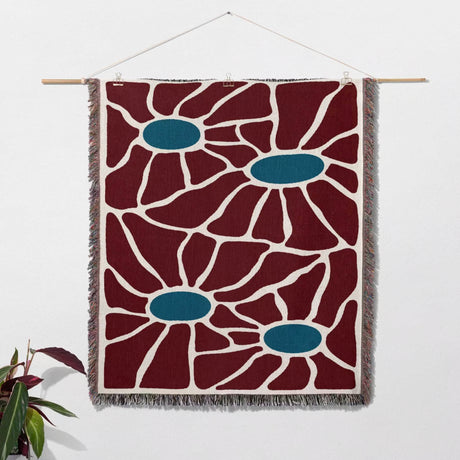 Eclectic Matisse inspired tapestry throw blanket for couch as a woven wall hanging with red and blue floral pattern on a white background