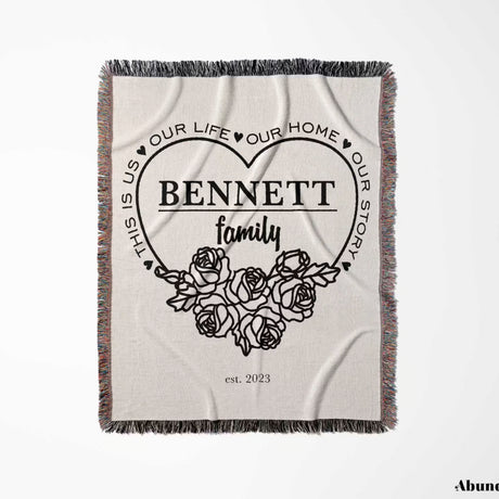 Family name personalized woven throw blanket gift for spouse with floral design and text full view on a white background