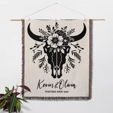 Floral cow skull cotton anniversary gift woven throw blanket as decorative wall hanging with bull skull design and personalized text, featuring a plant on a white background.