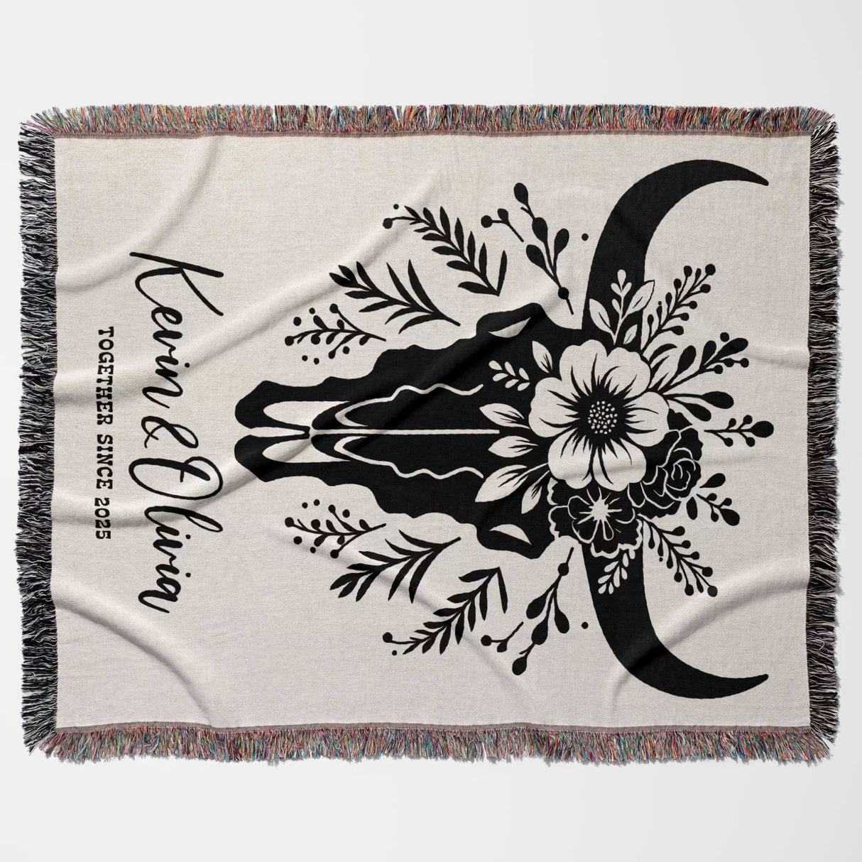 Floral cow skull cotton anniversary gift woven throw blanket flat lay with floral design and text on a white background