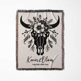 Floral cow skull cotton anniversary gift woven throw blanket full view with bull skull design and personalized text on a white background