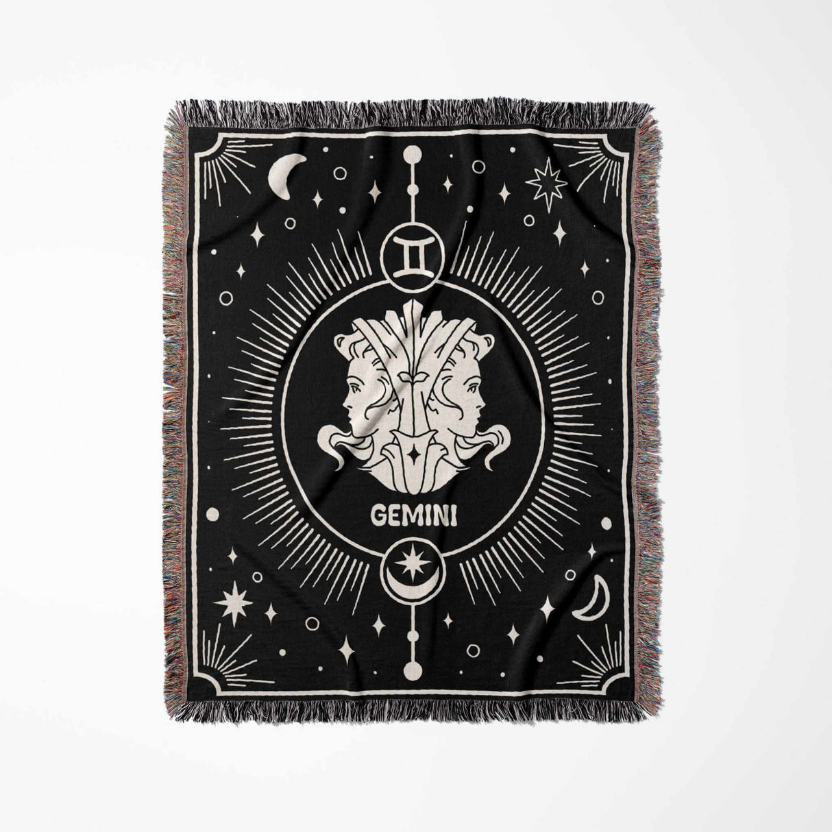 A vertically laid flat image of the Gemini Zodiac Blanket. The detailed design showcases the Gemini twins symbol, stars, and other celestial motifs in off-white against a black backdrop.