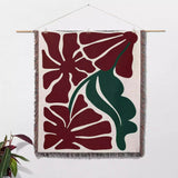 Henri Matisse red flowers woven throw blanket as woven wall art with red floral design on a white background