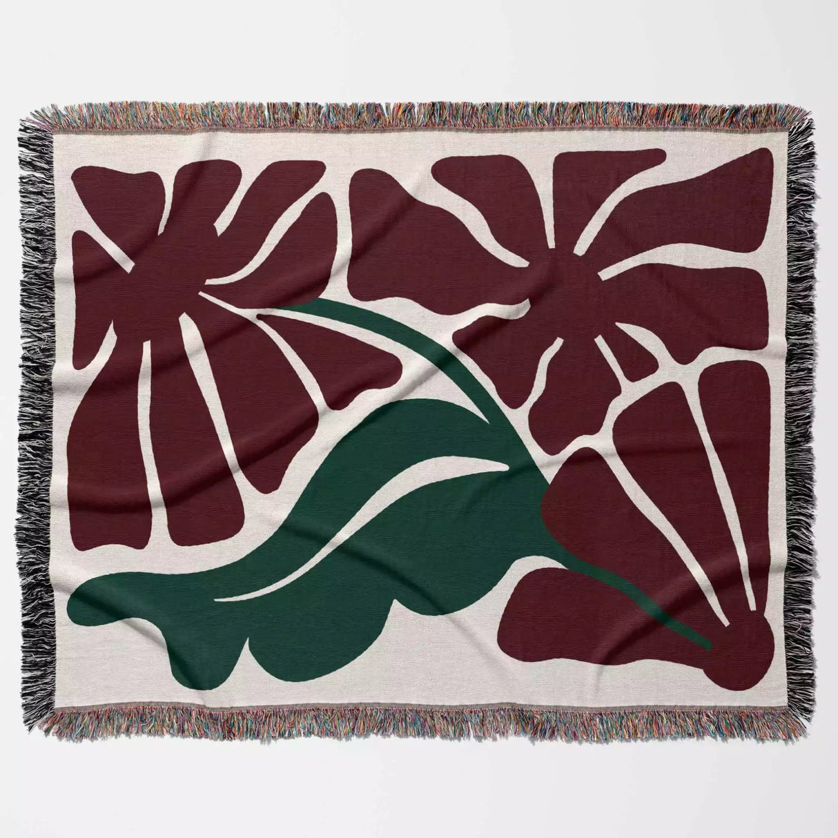 Floral patterned Henri Matisse red flowers woven throw blanket with red flowers and green leaves on a beige background