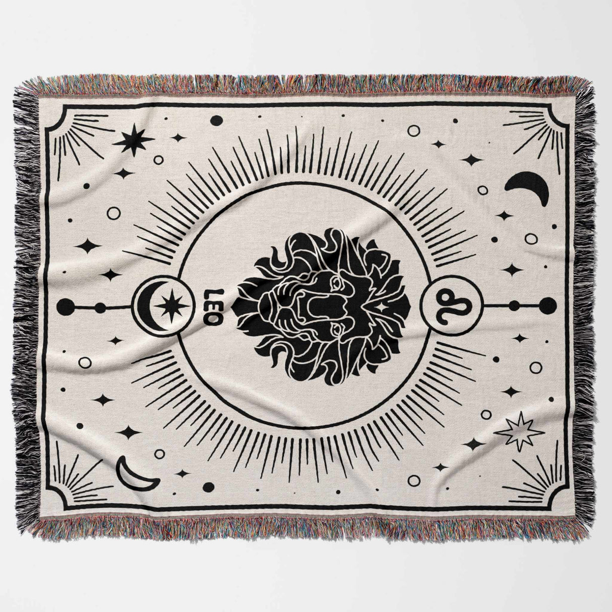 This image shows a flat lay of a Leo Zodiac Blanket. The woven tapestry blanket features a black-and-white design with a bold lion emblem and celestial motifs. Perfect for adding a regal touch to any room, it combines comfort with astrological elegance.