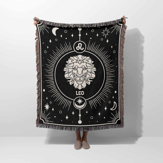 Held up to showcase its full size and design, the Leo Zodiac Blanket displays the central lion emblem and surrounding celestial patterns, making it an ideal gift for Leo zodiac enthusiasts.