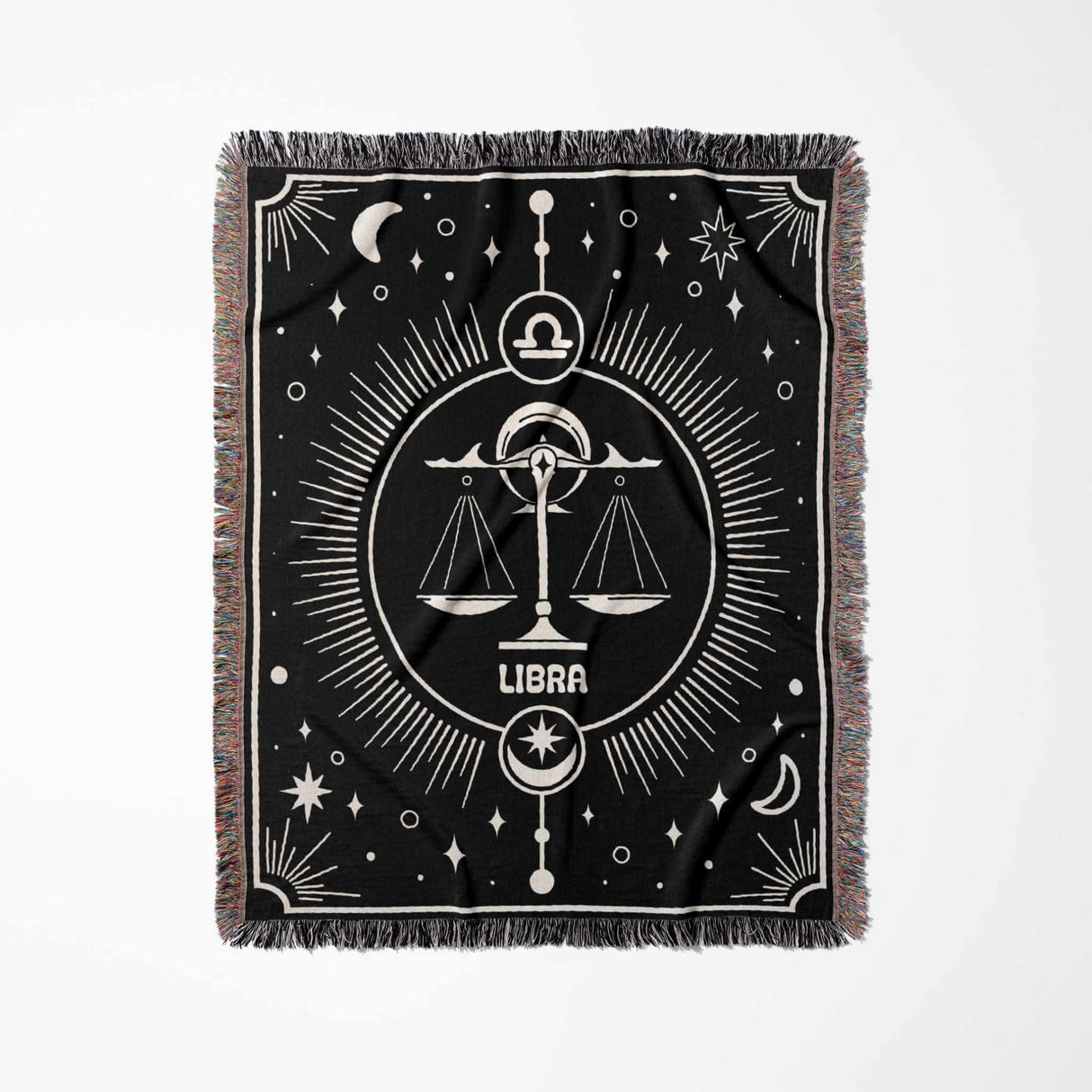 The Libra Zodiac Blanket displayed flat in a vertical orientation, highlighting the intricate woven details and the balance scales symbol of Libra, with decorative elements of the night sky and a multicolor fringe that frames the blanket.