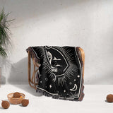 The Libra Zodiac Blanket draped elegantly over a wooden chair, demonstrating its use as a decorative throw. The scales symbol and celestial designs are visible, enhancing the aesthetic of the space, complemented by the multicolor fringe.