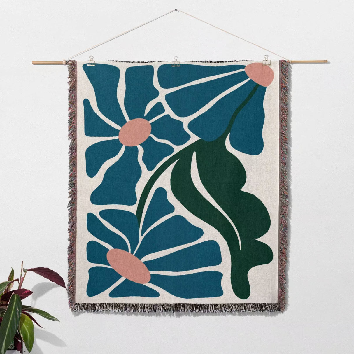 Matisse style floral cotton woven throw blanket for couch as a woven wall art with floral design on a white background