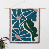 Matisse style floral cotton woven throw blanket for couch as a woven wall art with floral design on a white background