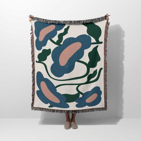 Matisse style flowers cotton woven throw blanket with abstract floral pattern on a white background