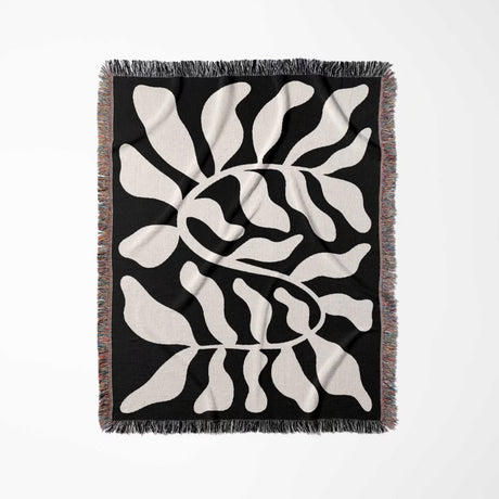 Black leaf Matisse throw blanket vertically flat on a white background