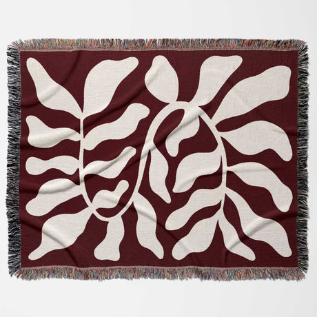 Red leaf abstract Matisse throw blanket full flat lay horizontally. 