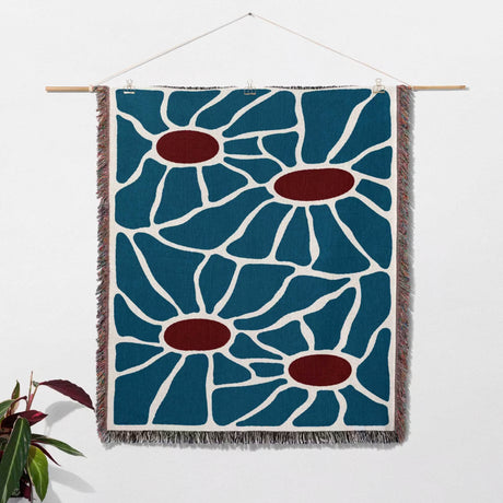 Maximalist Matisse inspired tapestry throw blanket for couch as a woven wall hanging with blue and red floral pattern on a white background