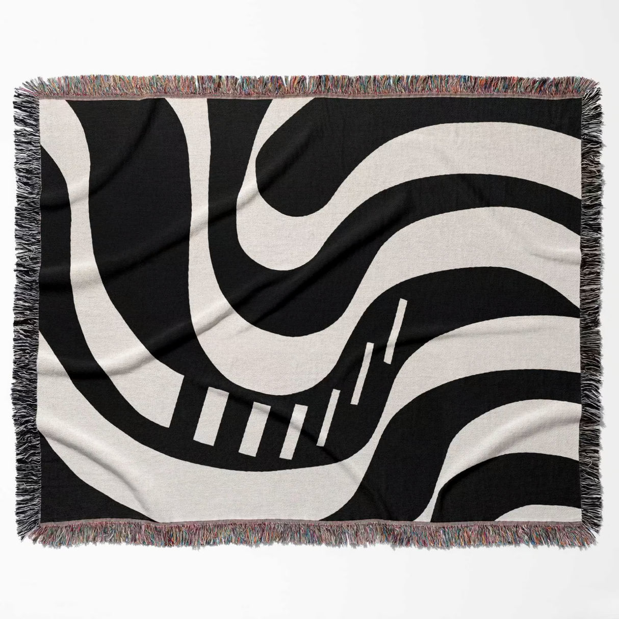 Black and white modern abstract art woven blanket throw tapestry flat lay on a white background.