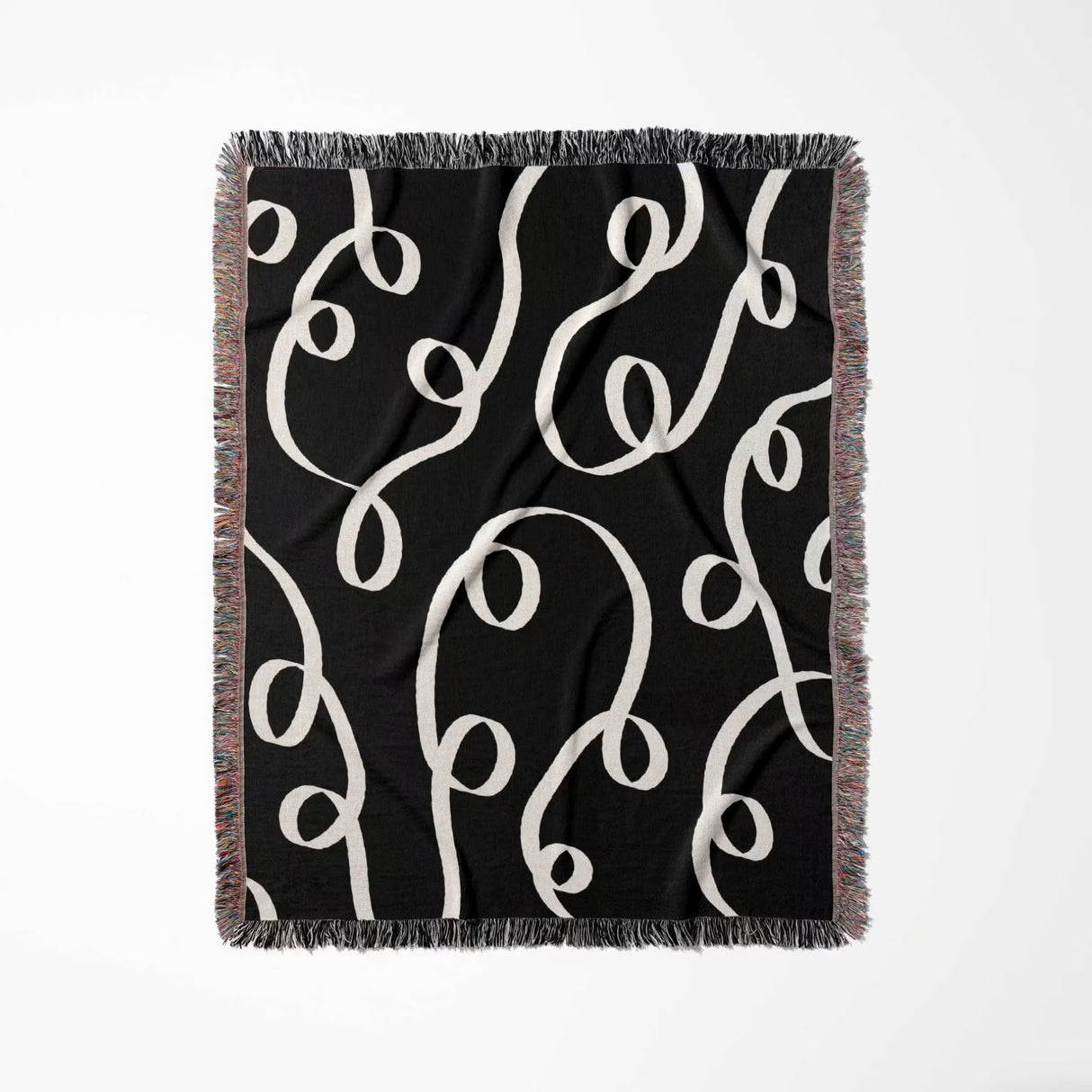 Black and white modern accent woven blanket throw tapestry full view on a white background.
