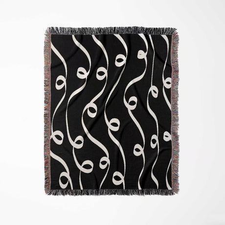 Black and white modern art decorative woven blanket throw tapestry full view on a white background