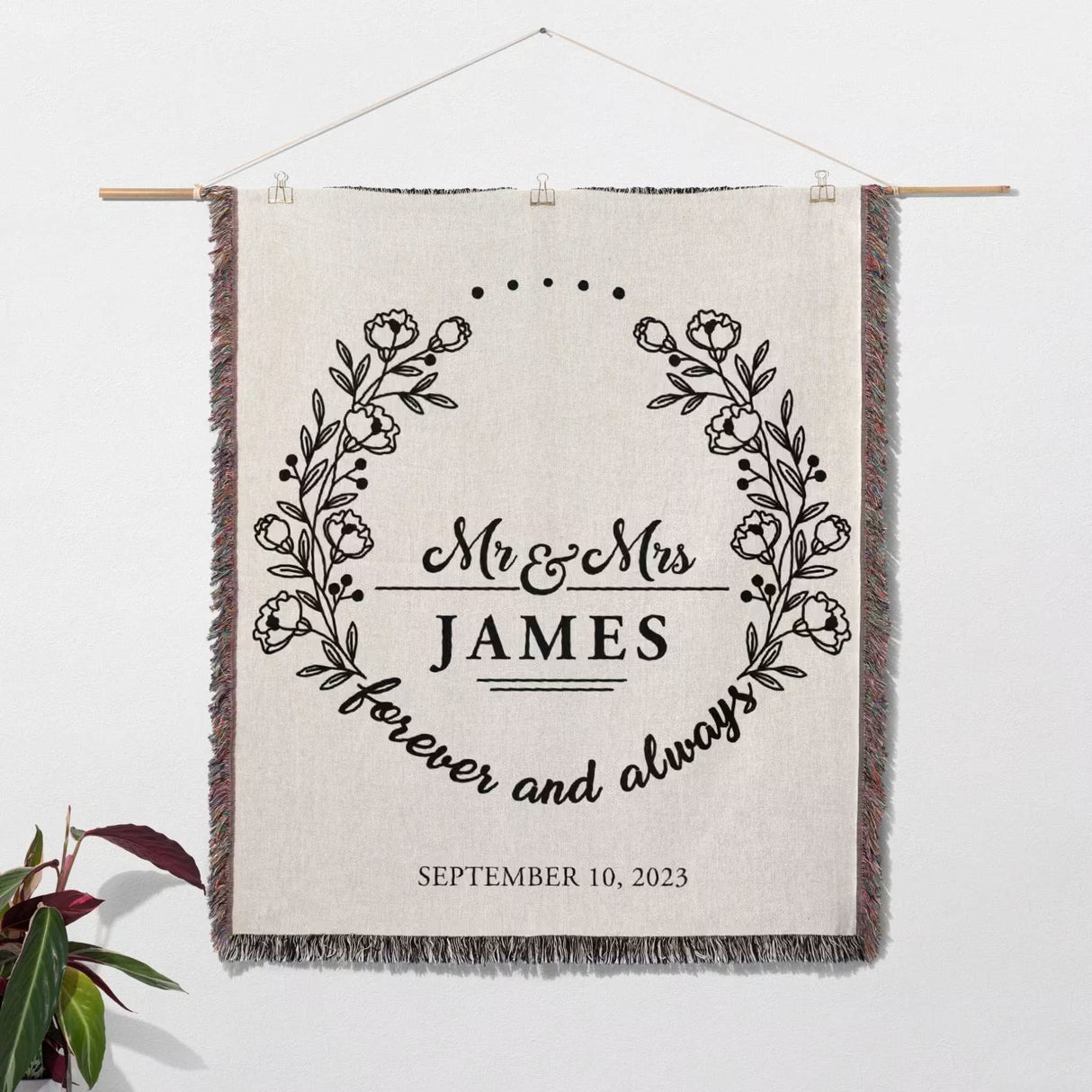 Mr and Mrs cotton wedding anniversary gift woven blanket with 'Mr & Mrs James forever and always' text and date, hanging on a white wall.