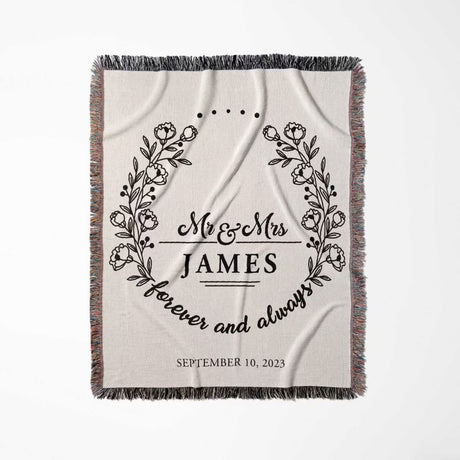 Mr and Mrs cotton wedding anniversary gift woven blanket  with floral wreaths and text full view on a white background