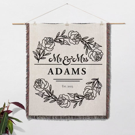 Personalized 2 year anniversary gift - Mr and Mrs woven throw blanket with floral design and text 'Mr & Mrs Adams Est. 2023' on a white background