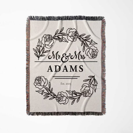 Personalized 2 year anniversary gift - Mr and Mrs woven throw blanket with floral design and 'Mr & Mrs Adams' text full view on a white background