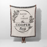 Personalized 2 year anniversary gift for wife woven throw blanket with 'David & Sarah The Cooper Family' text and floral design on a white background