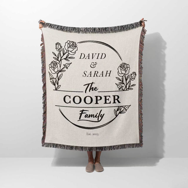 Personalized 2 year anniversary gift for wife woven throw blanket with 'David & Sarah The Cooper Family' text and floral design on a white background
