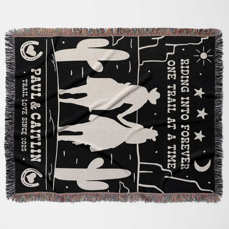 Personalized cowboy and cowgirl 2nd anniversary gift woven throw blanket flat lay with horse design and text on a black background